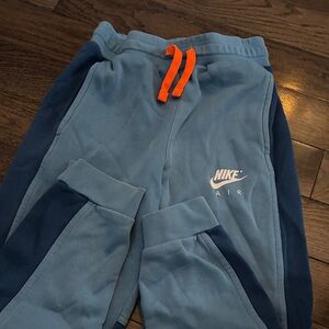 Nike Kids Blue and Navy Joggers with Orange Accents